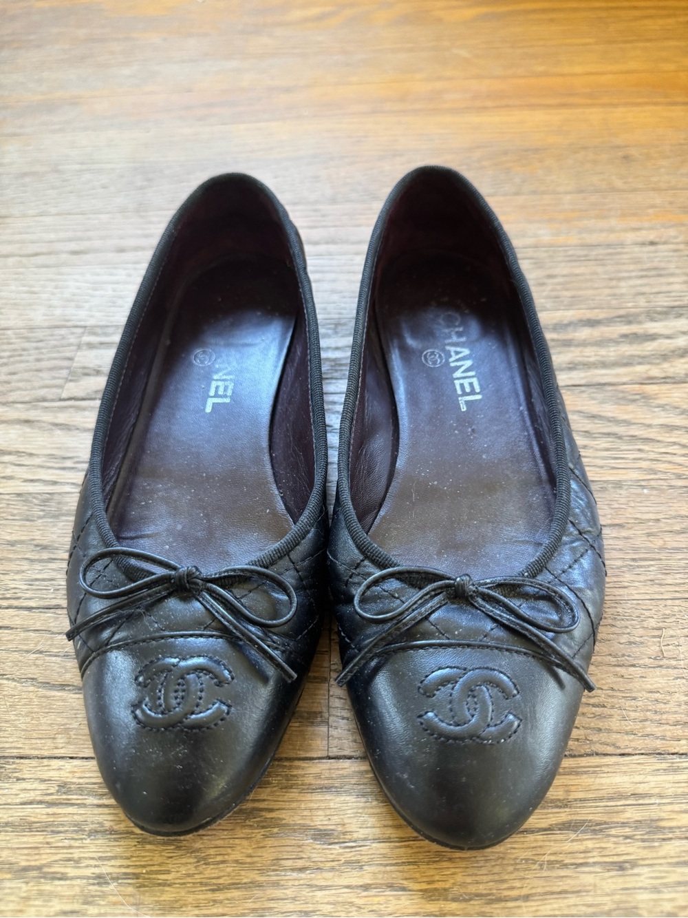 CHANEL Black Quilted CC Cap-Toe Ballet Flats